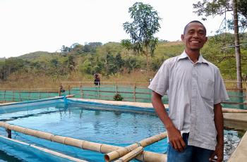 Roberto Bau Maria, a fish farmer in Leohitu, grew his business and brings home more fish to eat. Photo: Kate Bevitt
