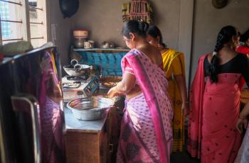 Preparing mola, a small, nutrient-rich fish, for cooking, a traditional and important source of vitamins and minerals in local diets in Assam. Photo by WorldFish.