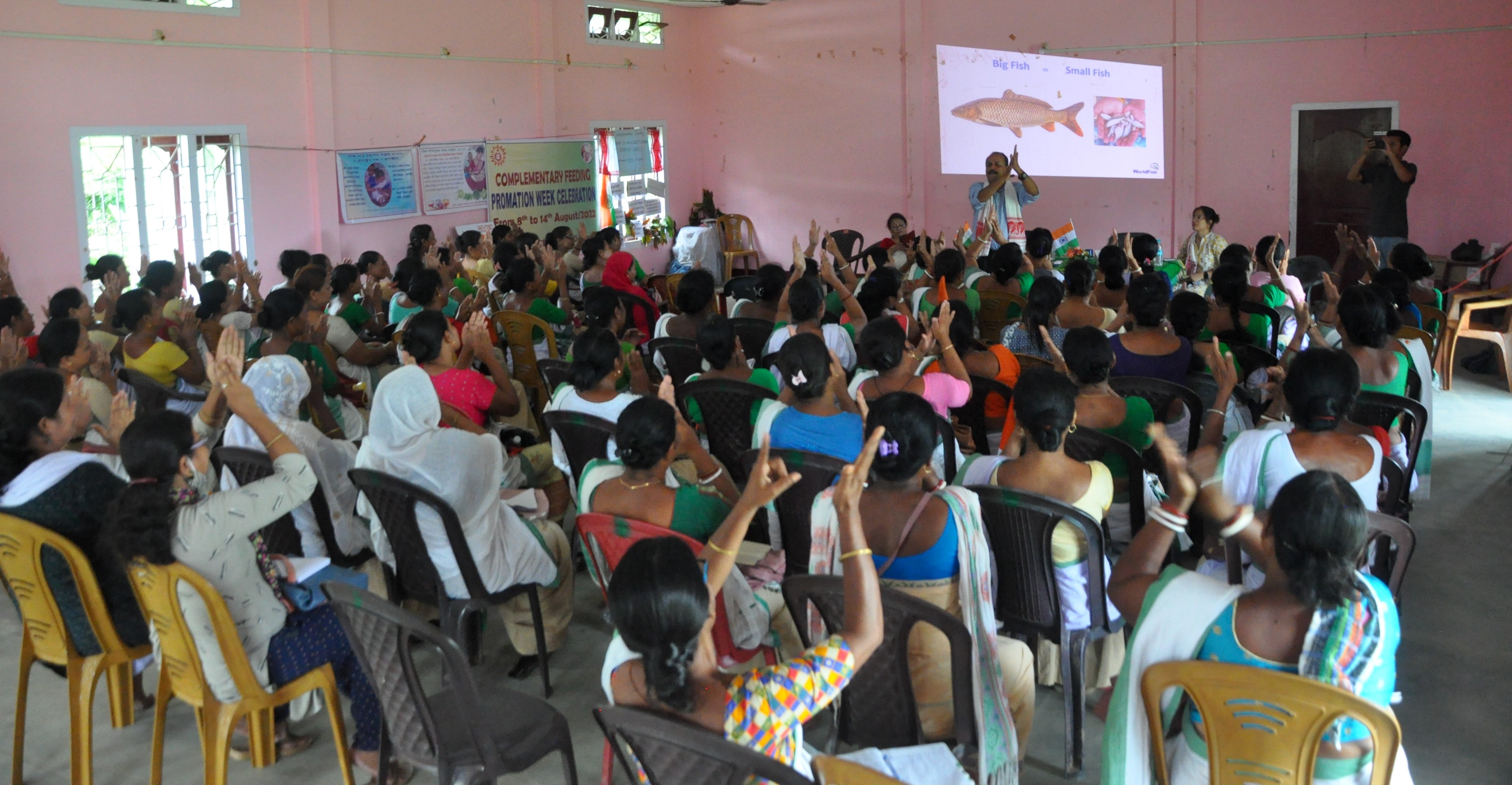 Participants learn about the nutritional benefits of small fish and how simple household practices can improve family diets during a community event in Assam. Photo: Dr. Dharitri/WorldFish.