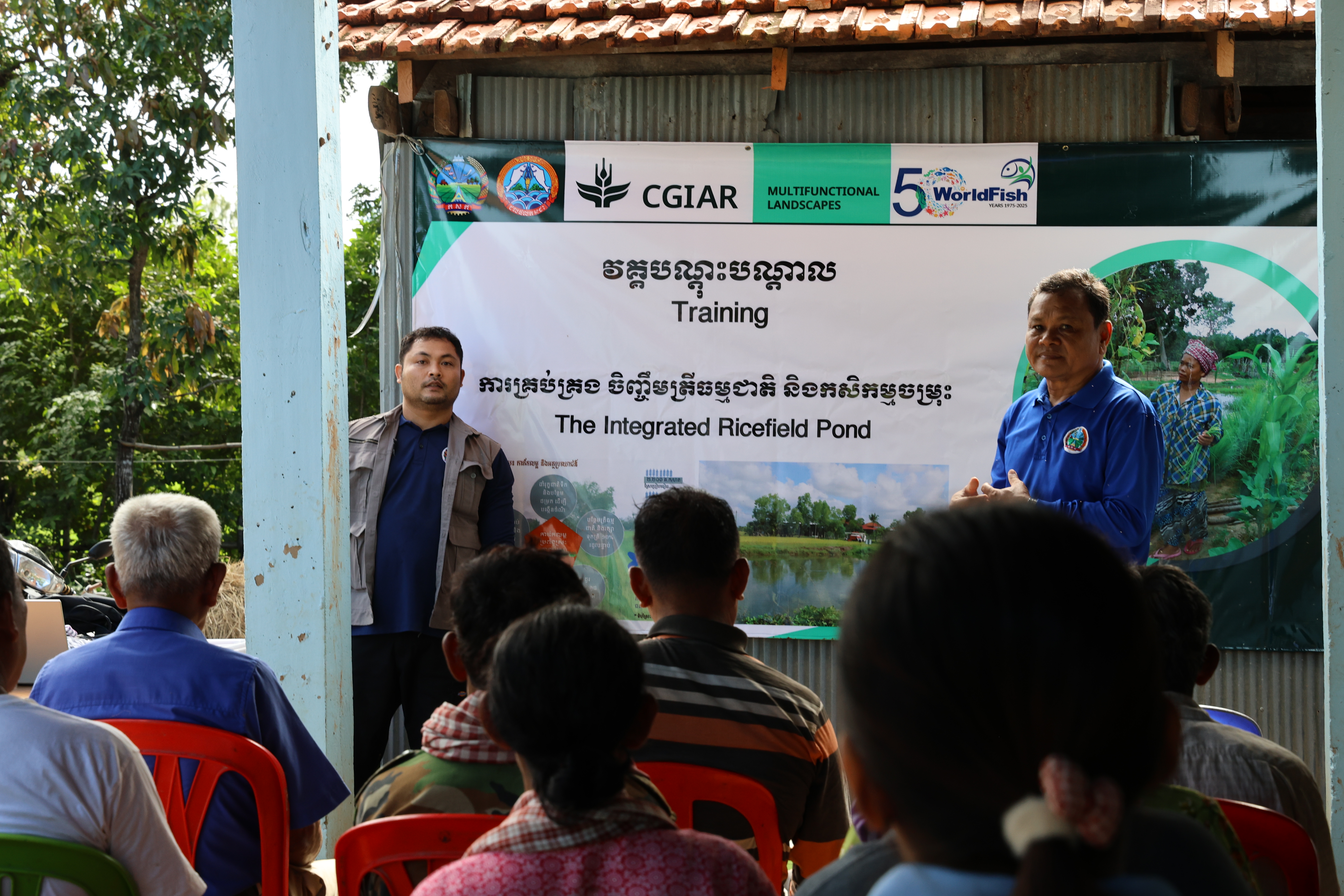 District Agriculture Officer Prum Sophat at a training on rice field pond systems