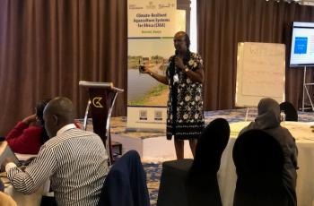 Suzanne Kuria of AWFISHNET explaining their approach to capacity building and market access for women