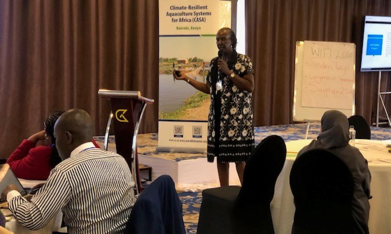 Suzanne Kuria of AWFISHNET explaining their approach to capacity building and market access for women